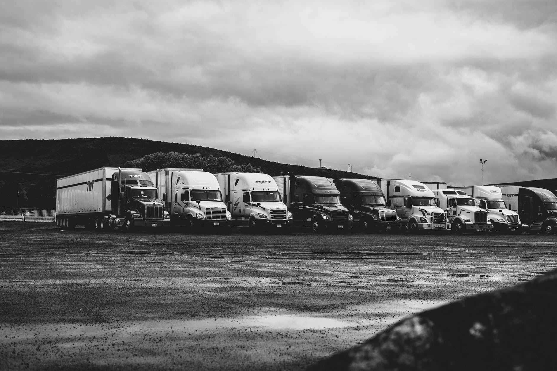 parked trucks under clouds