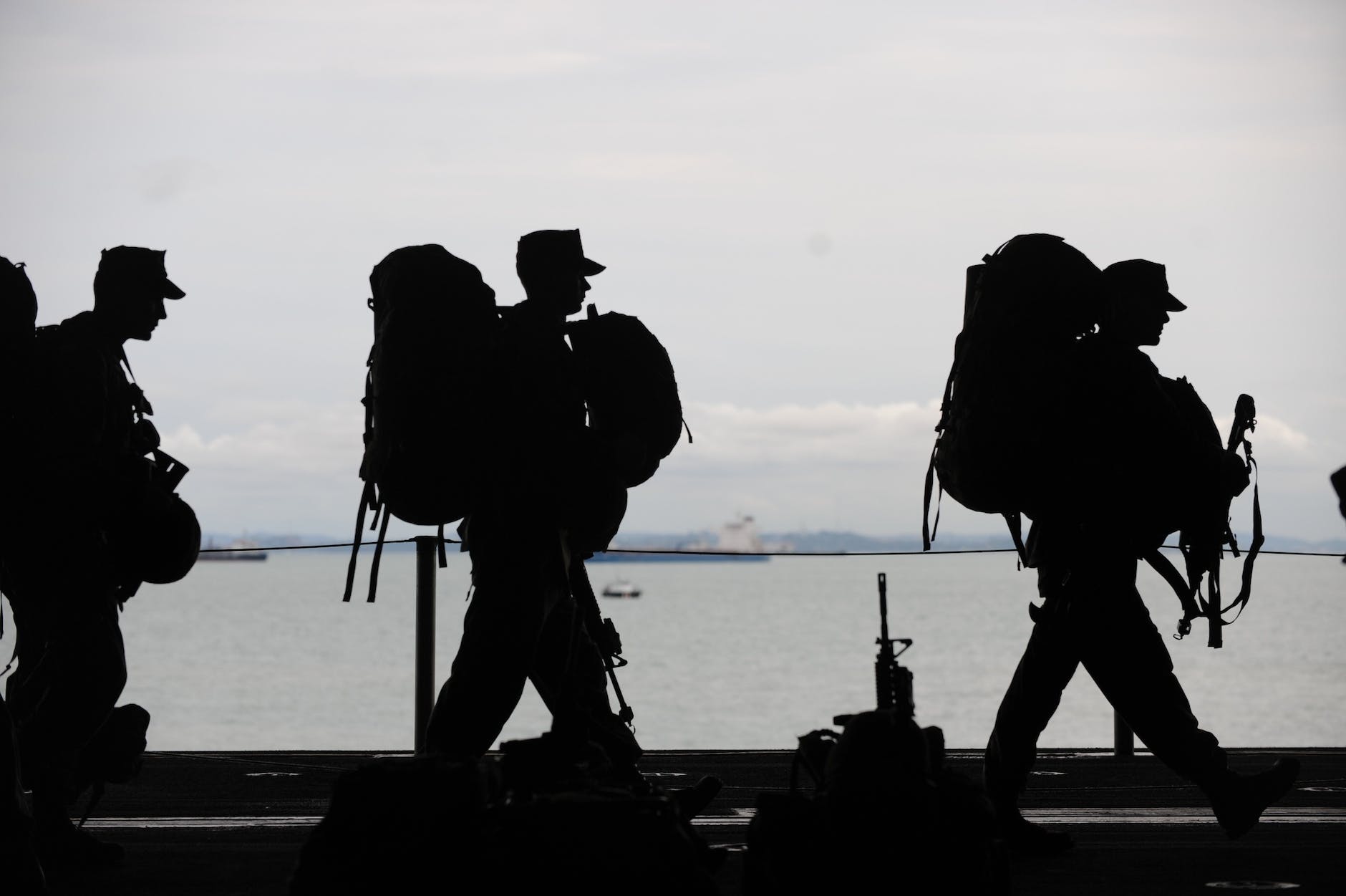 silhouette of soldiers walking