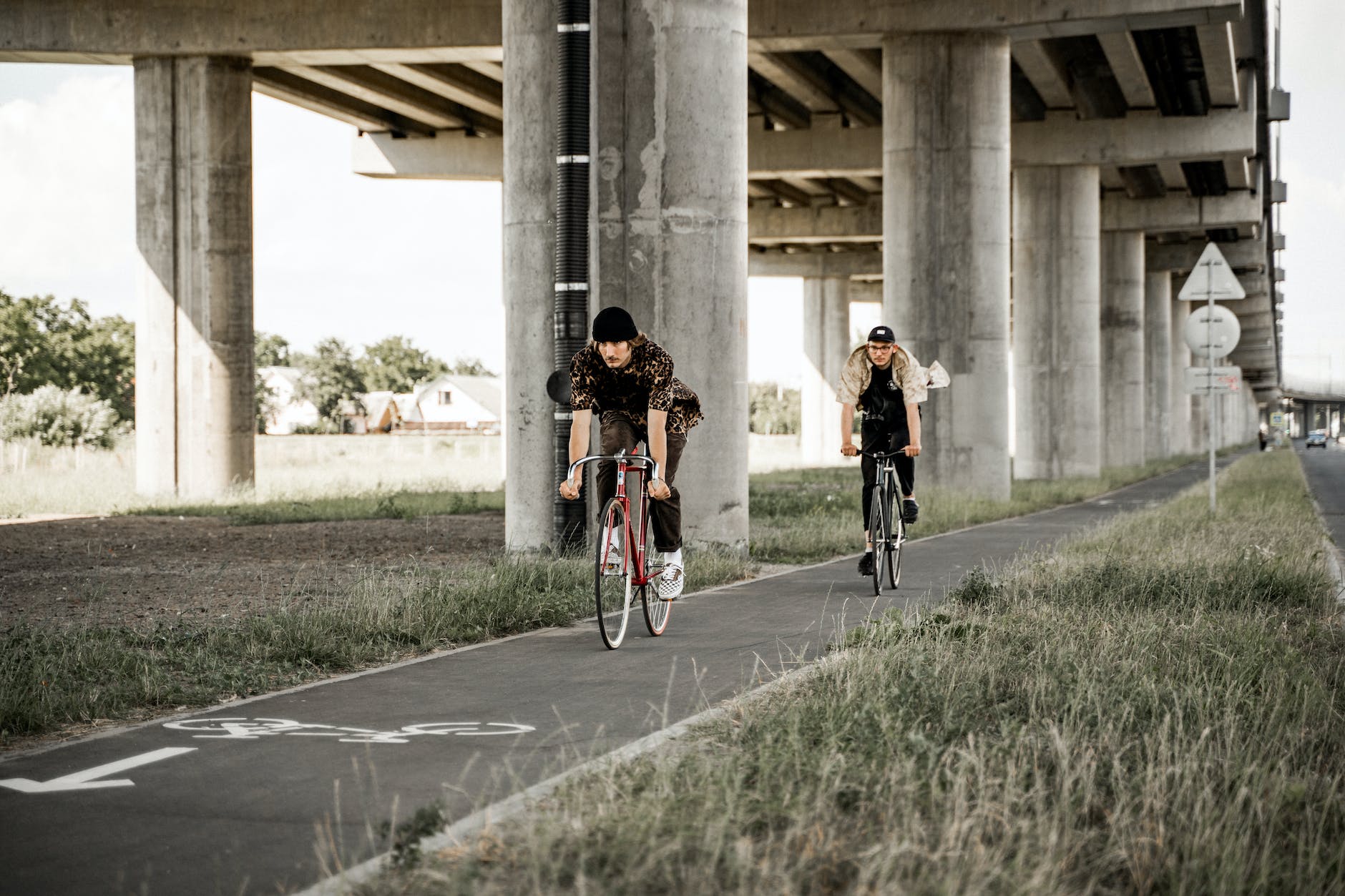 men riding their bike in the bike lane