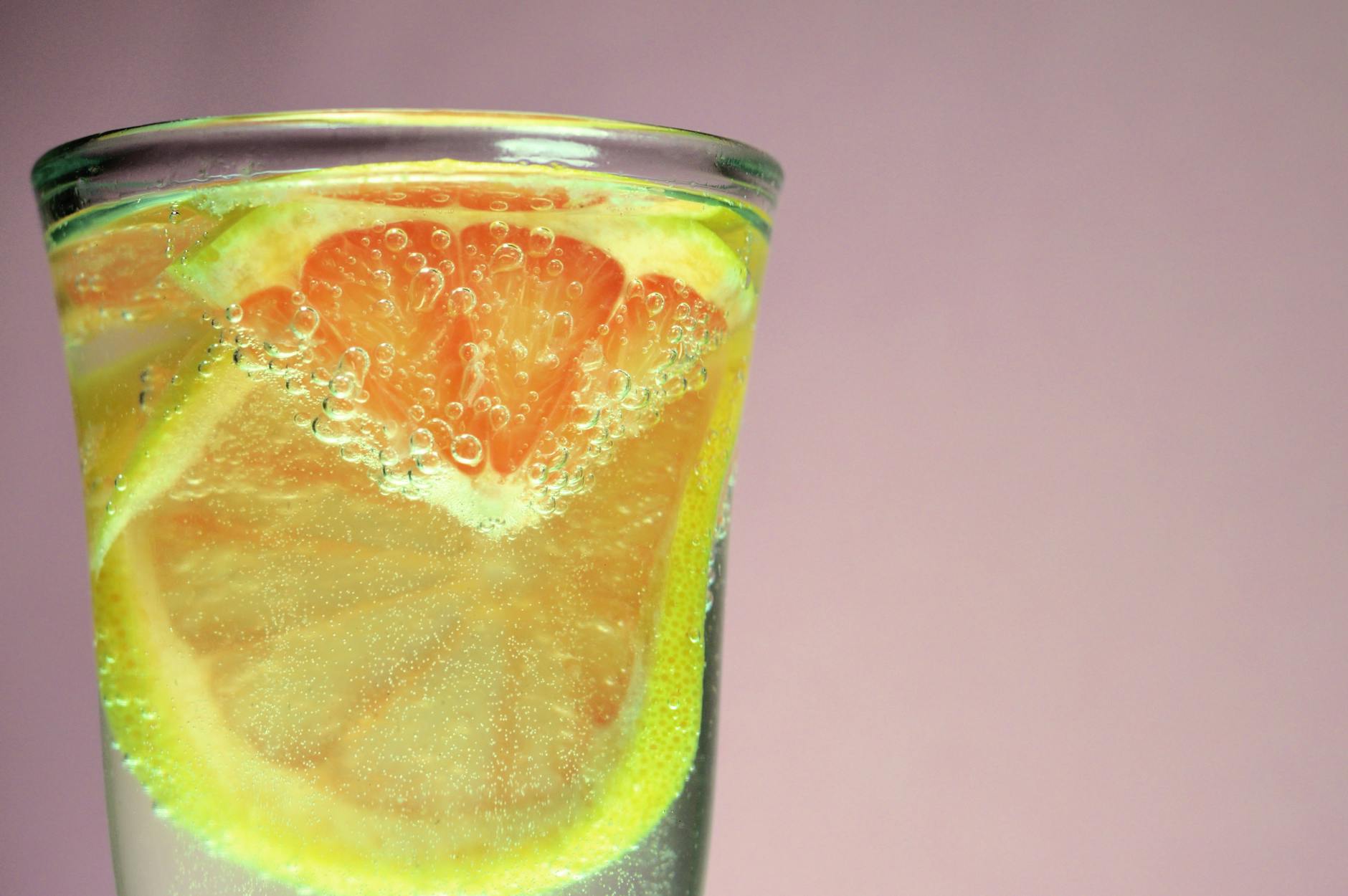 selective photography of citrus drink